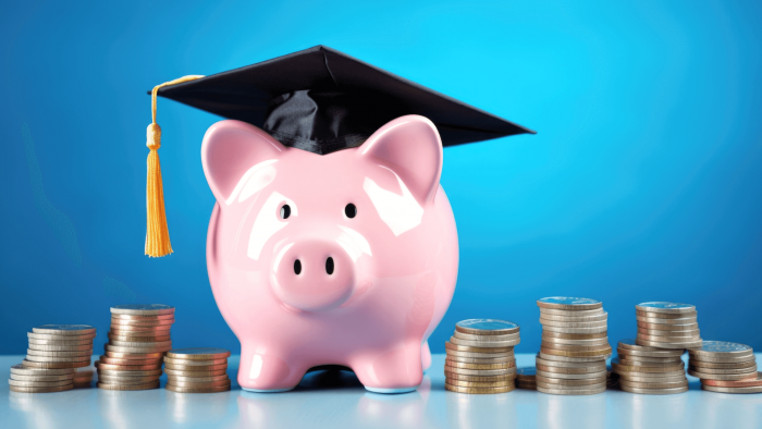 Piggy bank wearing graduation cap
