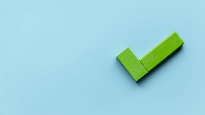 green checkmark on light blue background