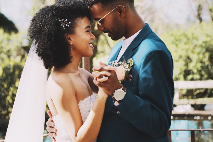 Man and woman in wedding attire dancing