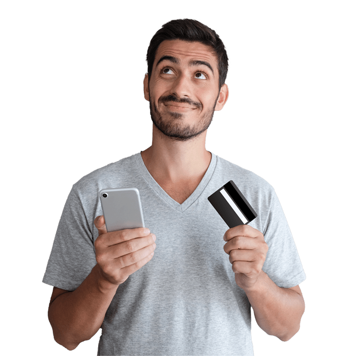 Man holding cell phone in one hand and credit card in the other