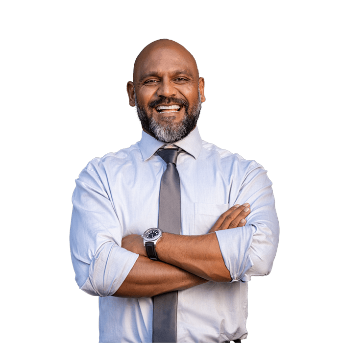 Older man wearing suit and tie and crossing arms