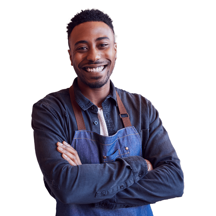 Man with work apron on folding hands