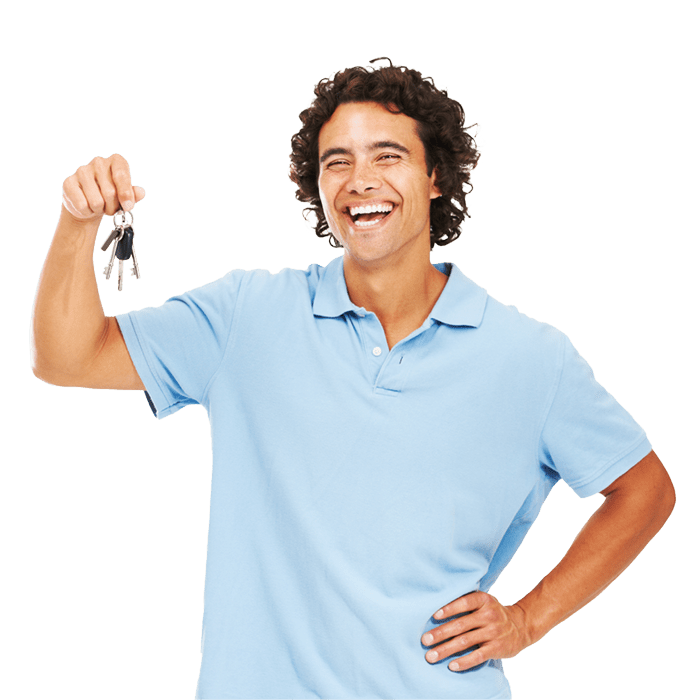 Man smiling while holding keys